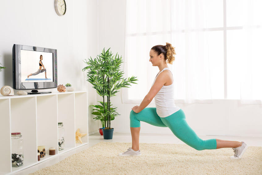woman exercising with video