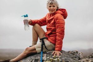 senior hiker resting on rock | Princeton Nutrients
