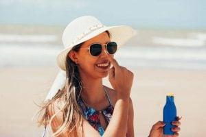 woman applying sunscreen | Princeton Nutrients