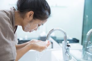 woman cleaning face | Princeton Nutrients